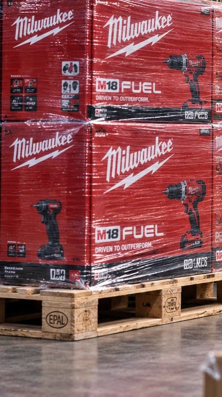 Shrink-wrapped pallet of Milwaukee M18 FUEL boxes in the warehouse